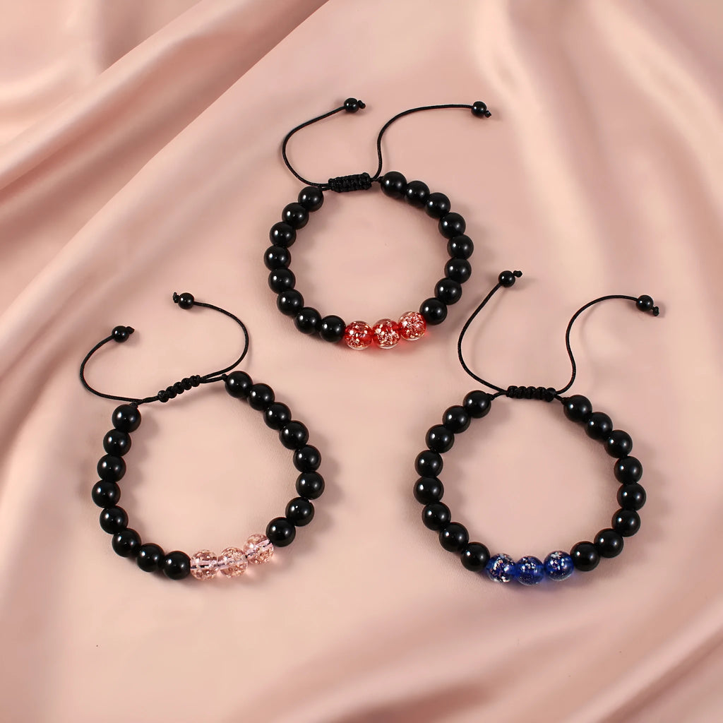 Beaded adjustable luminous bracelet in six colours: black, red, green, pink, blue, sapphire blue, glass or coloured glaze beads, geometric shape