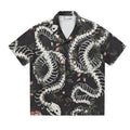 Short sleeve Cuban collar shirt with original snake bone and floral pattern print in a loose fit.