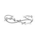 White gold copper branch sprout bracelet with twisted cross design on wrist