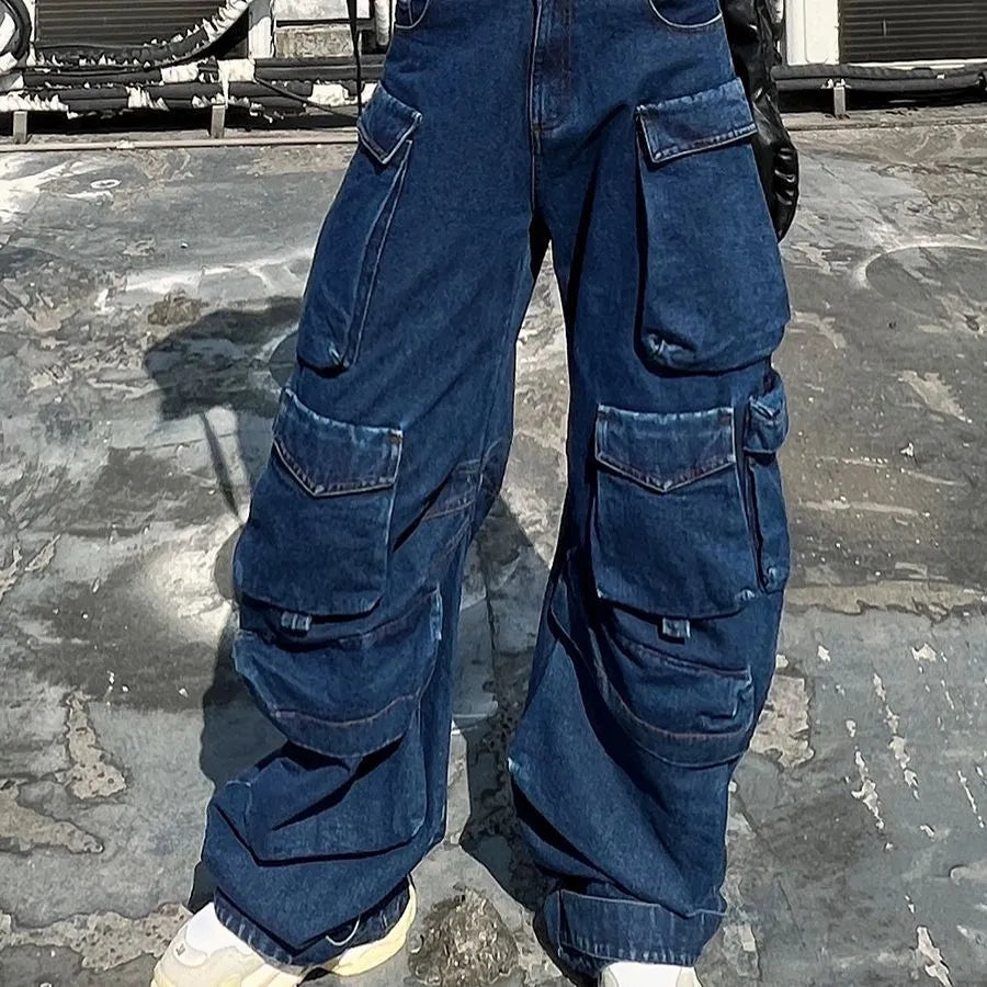 Dark blue distressed wide-leg high-waist jeans with multiple pockets on a street fashion model