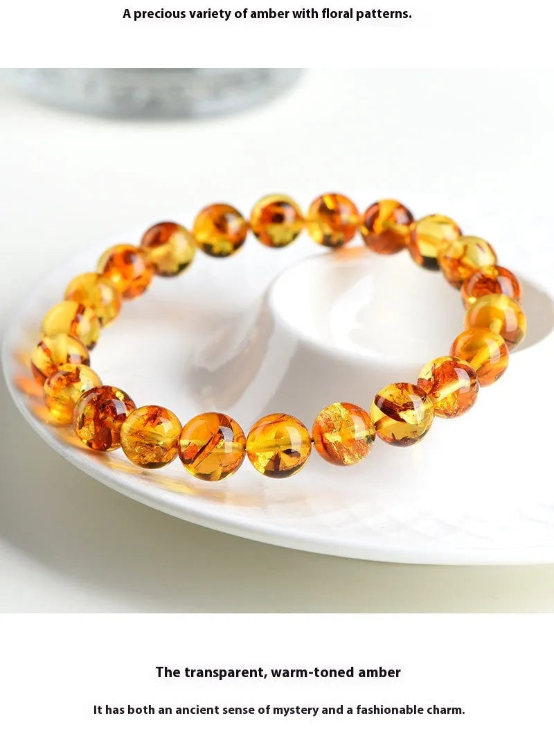 Natural yellow piebald amber bracelet with geometric beads and polished finish