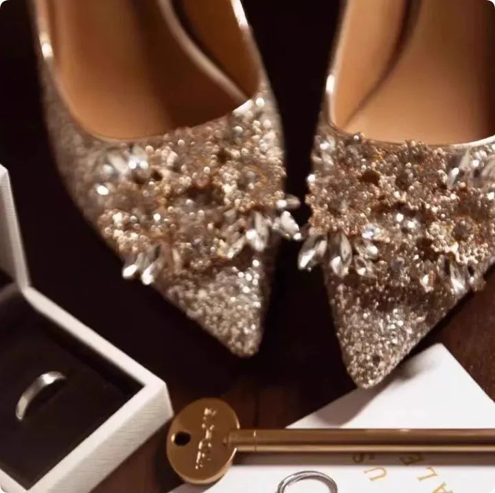 Champagne coloured bridal shoes with crystal rhinestones, pointed toe, and court heel.