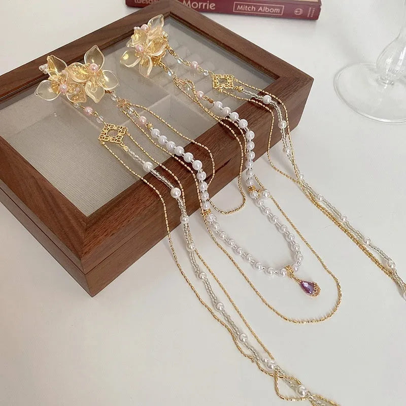 Gold women's hairpin with pearl, diamond and flower decoration and long tassel