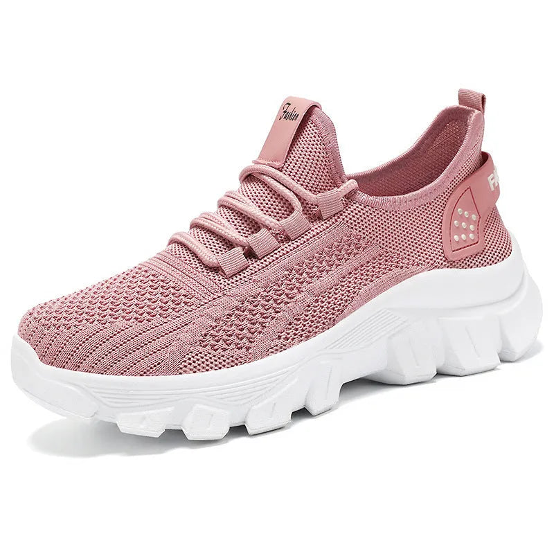 Men's white Flyknit running shoes with thick PVC sole and lace-up front.