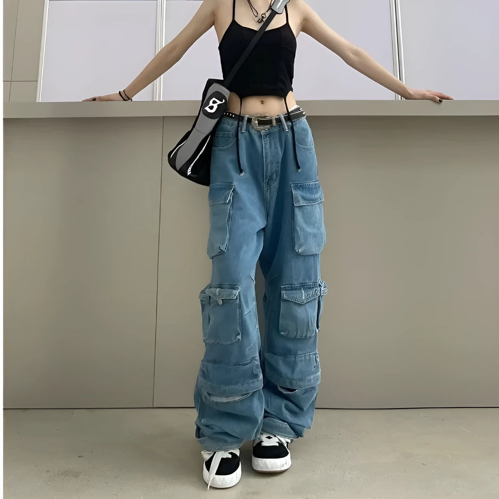 Women's blue tie-dyed wide-leg high-waist jeans with multiple pockets on a street hipster style denim overall.