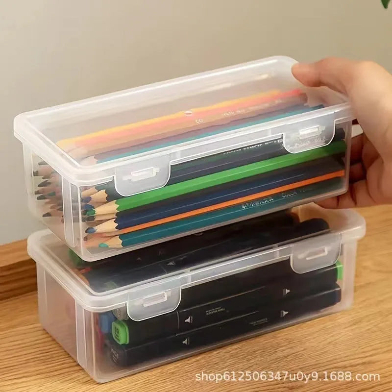 Large transparent plastic stationery storage box filled with colour pencils and crayons.