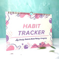 English habit tracking journal with 12 pages in 21cm by 28cm size, showing four colour options