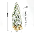 24-inch green PE plastic Christmas tree with lights and snow spray decoration on desktop