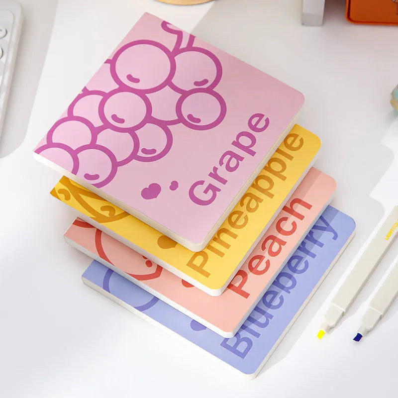 Square notebook with colourful embossed fruit cover designs, showing 14.5 cm size and thickened pages.