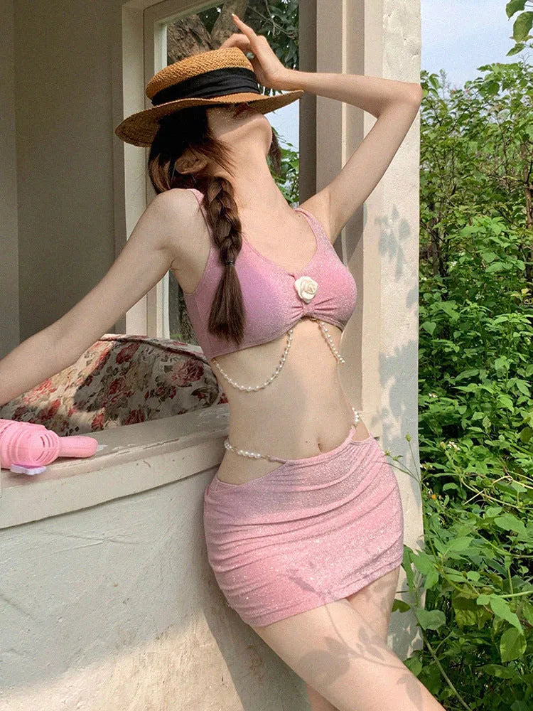 Three-piece bikini swimsuit in pink or black colours with briefs styling and sleeveless design for swimming
