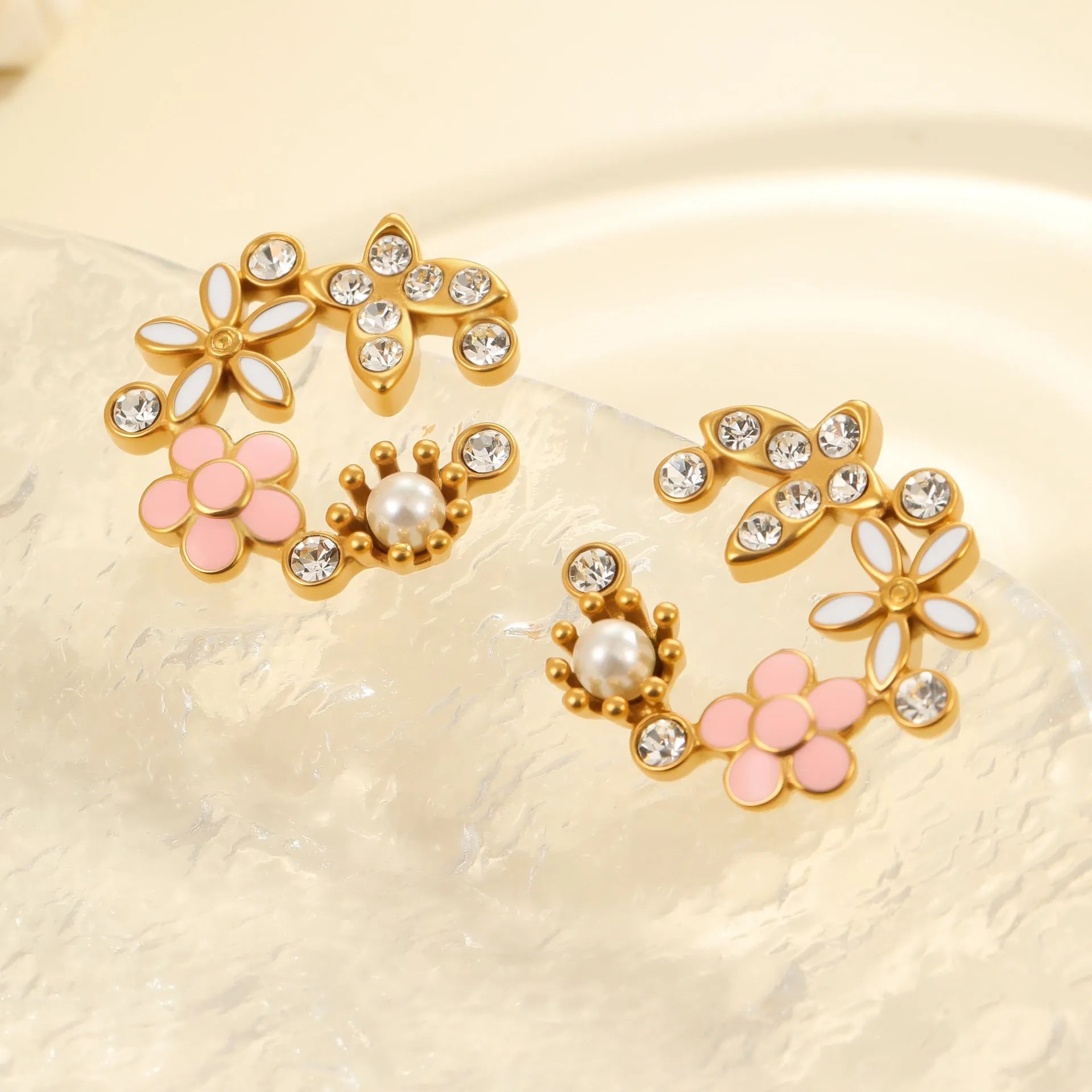 Gold plated flower stud earrings with colourful petal design on stainless steel