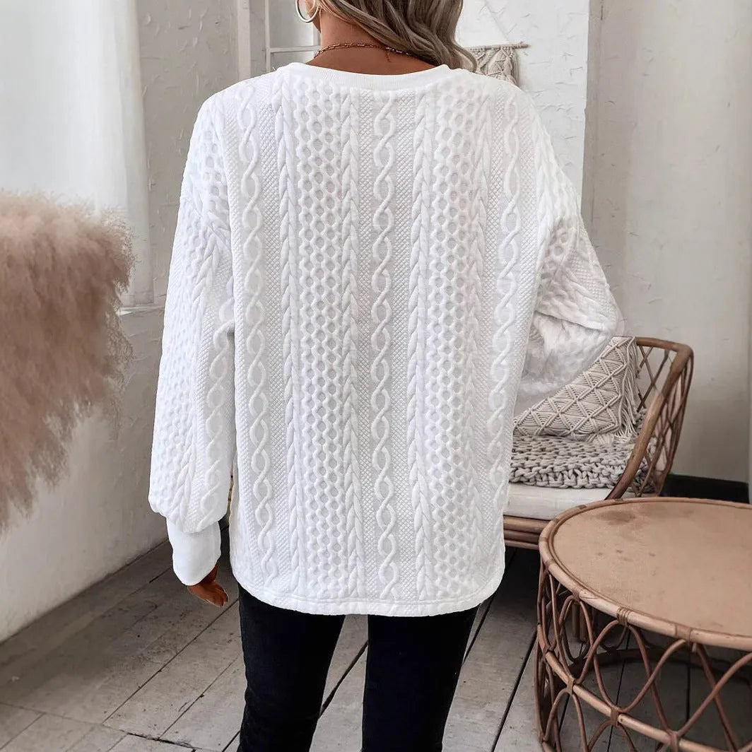 Milk white loose fit long sleeve t-shirt with a subtle 3D pattern on a casual model