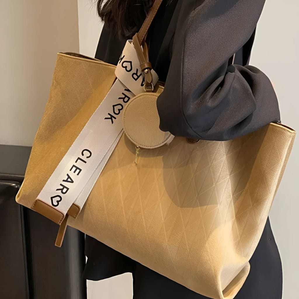 Soft polyester large tote shoulder bag in horizontal square shape with zippered pocket.