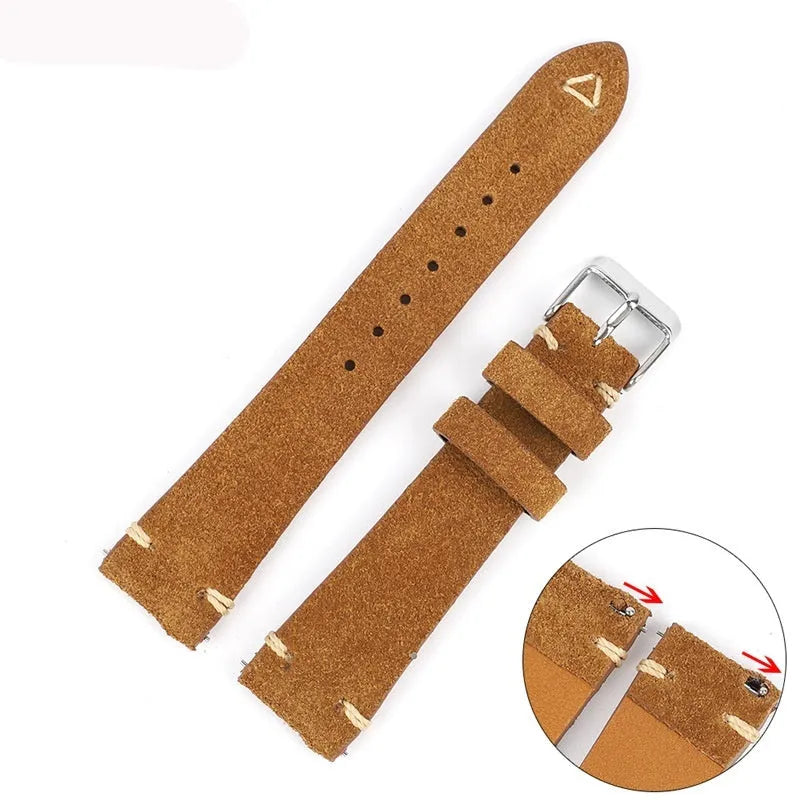 Brown genuine suede leather watch strap showing textured surface and buckle, laid flat.