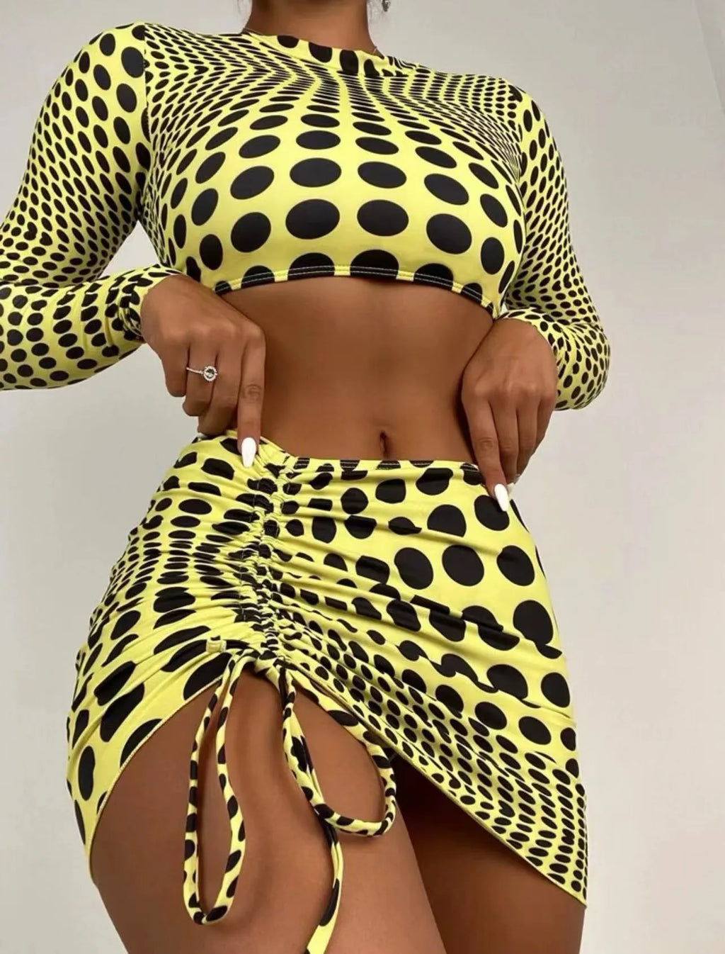 Women's polka dot swimsuit three-piece set in green, including top, skirt, and bra, made of polyester.