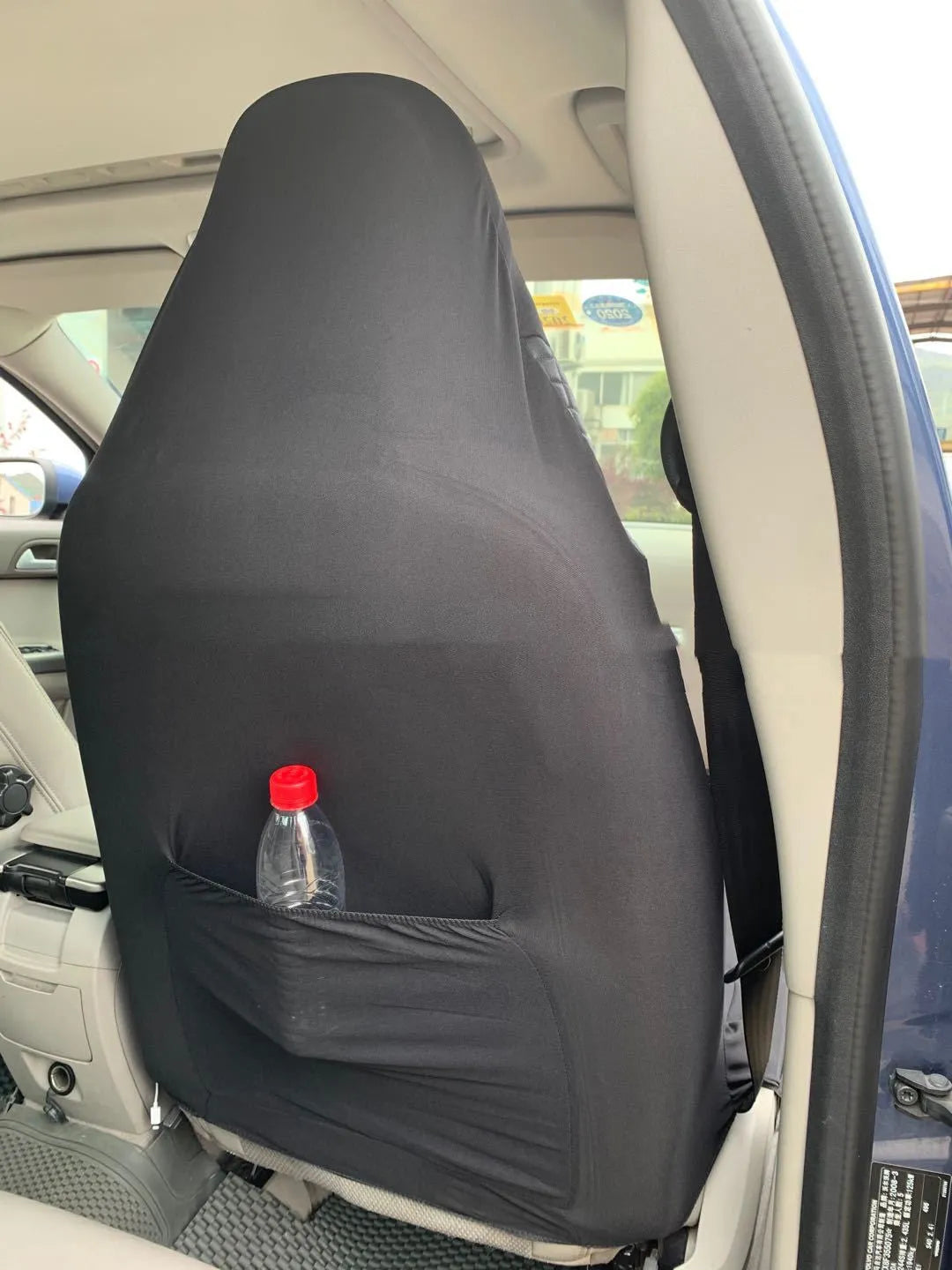 Black quilted universal car seat cover with plastic hook fastening system