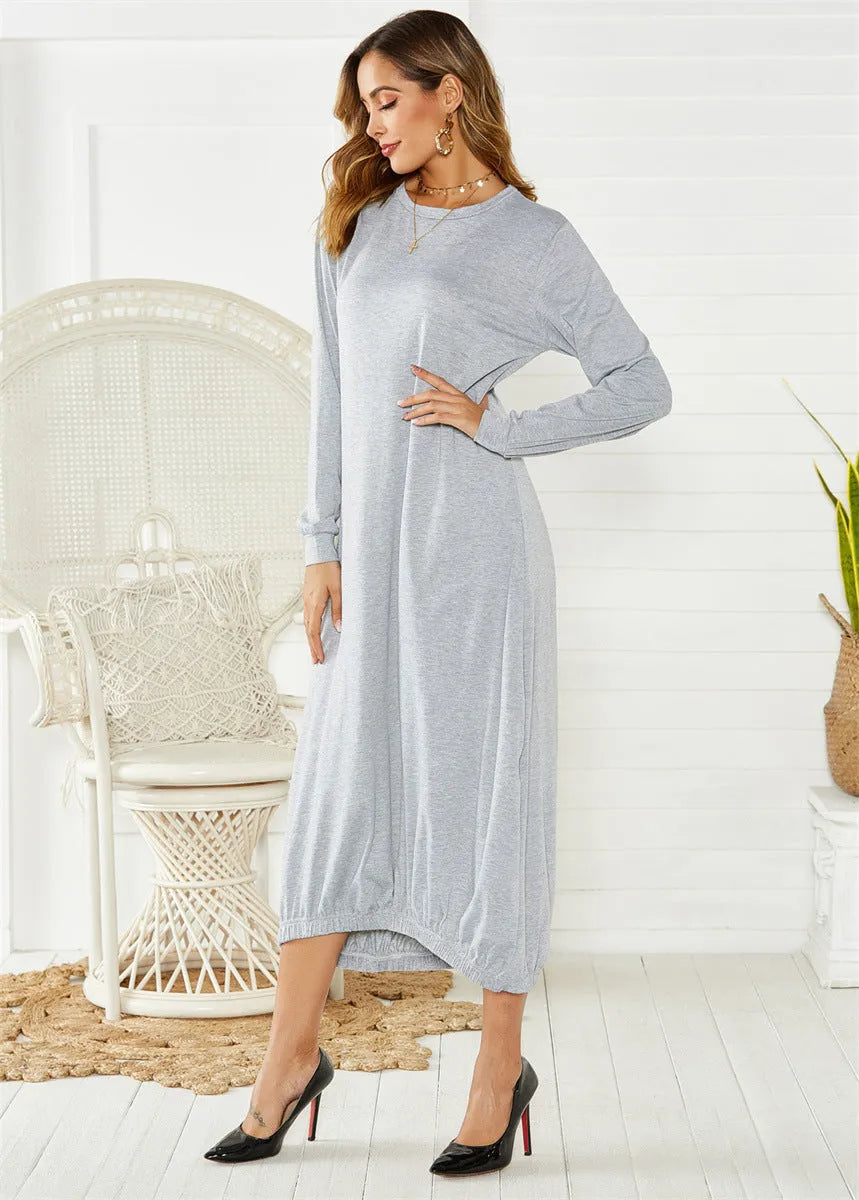 Black lantern dress with lace-up crew neck and loose long silhouette on a hanger.