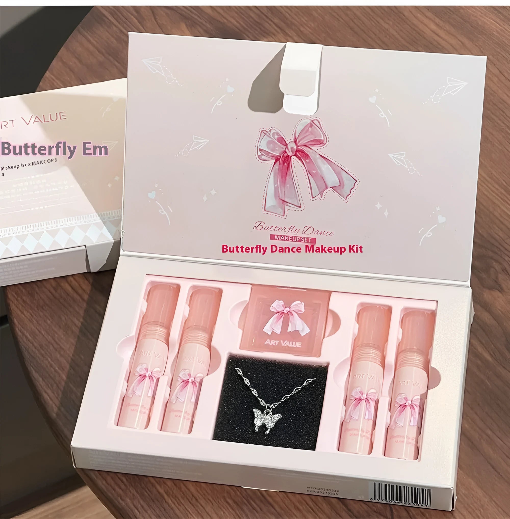 Butterfly Box pink makeup set with four lip mud products, powder blusher and necklace