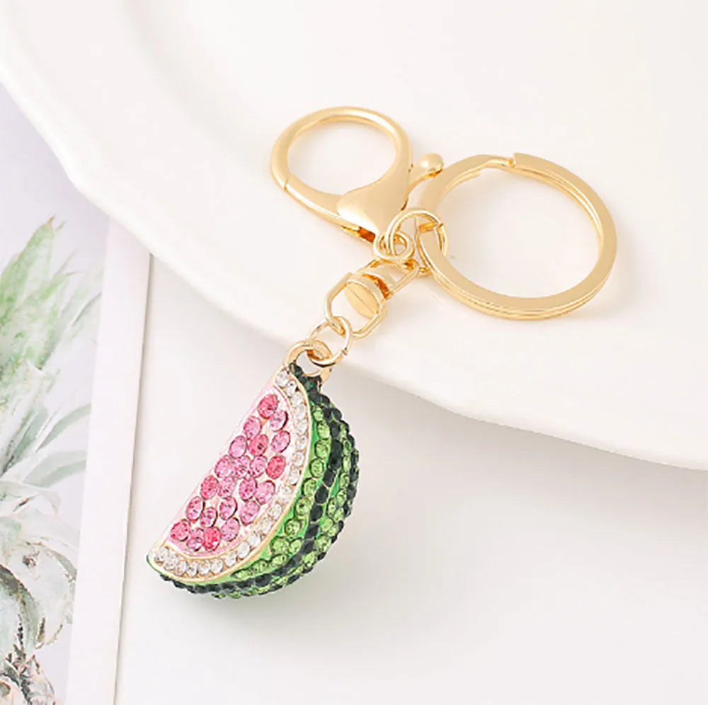 Creative watermelon shape metal car keychain in red on a white background