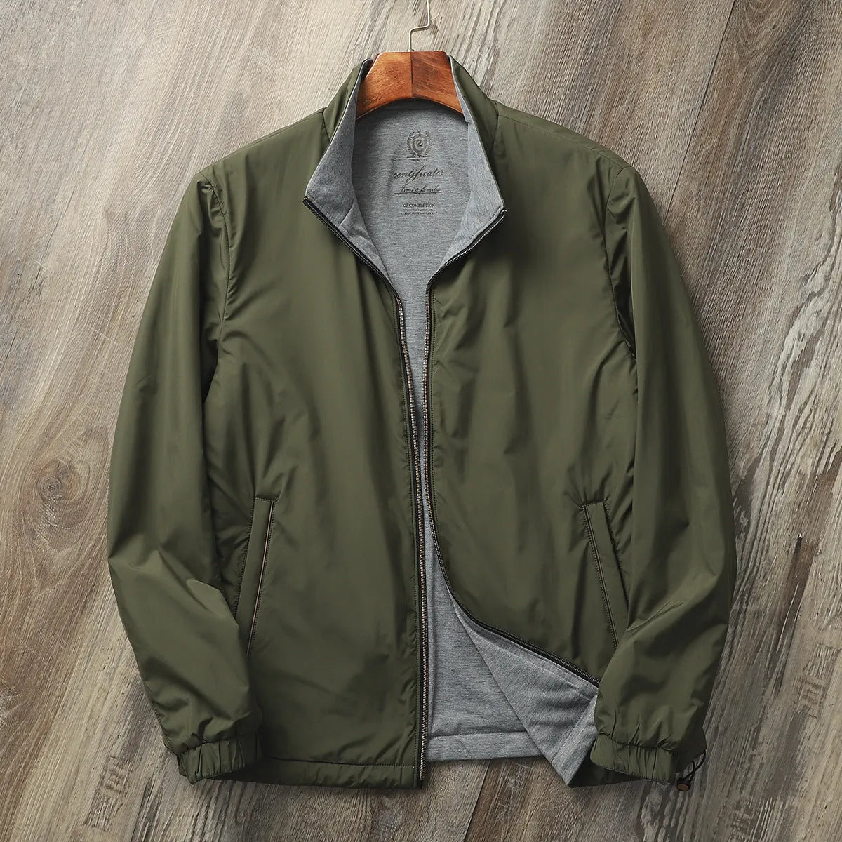 Men's stand collar casual jacket in blue, shown on a model.