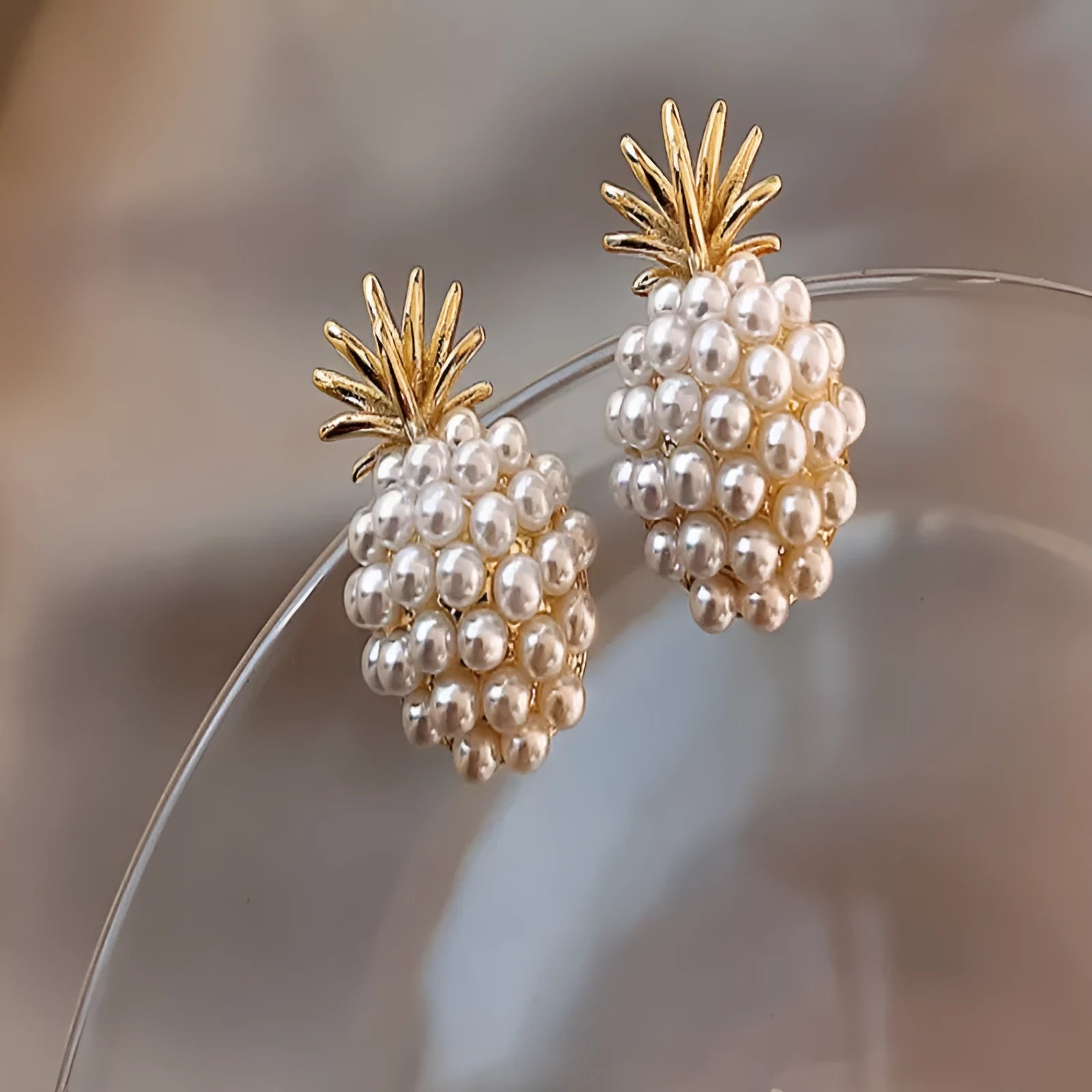 Korean style pineapple and starfish pearl earrings with electroplated alloy construction and artificial gem accents.