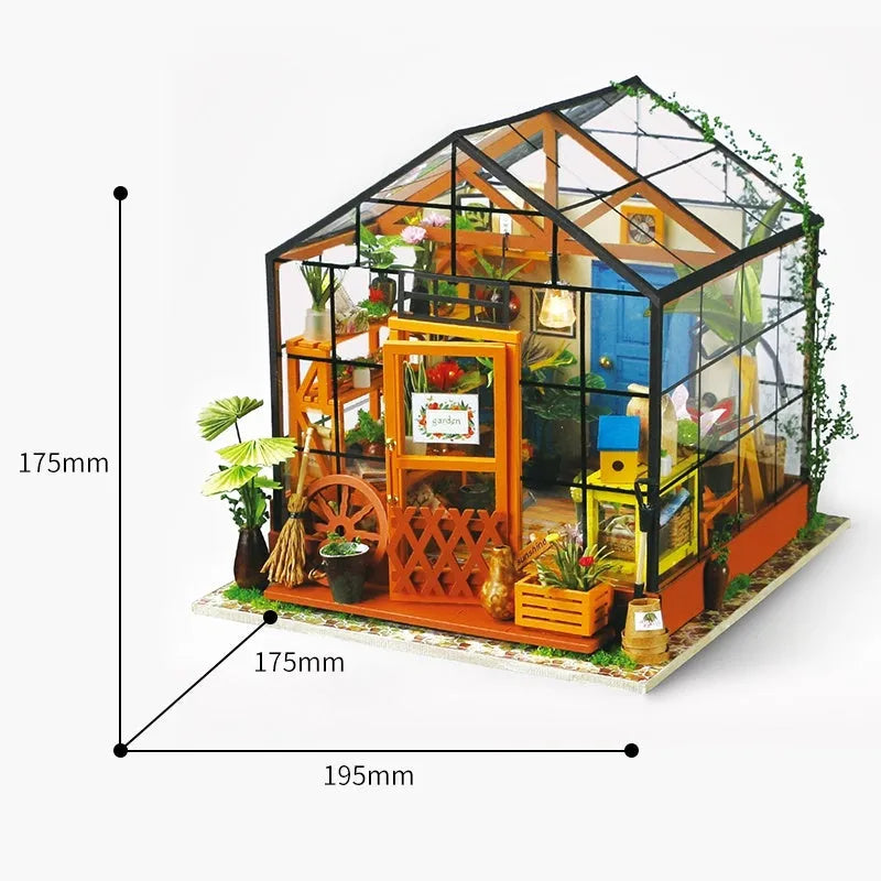 Robotime Kathy's Green Garden miniature doll house with LED light and glasshouse, finished display model on a shelf.