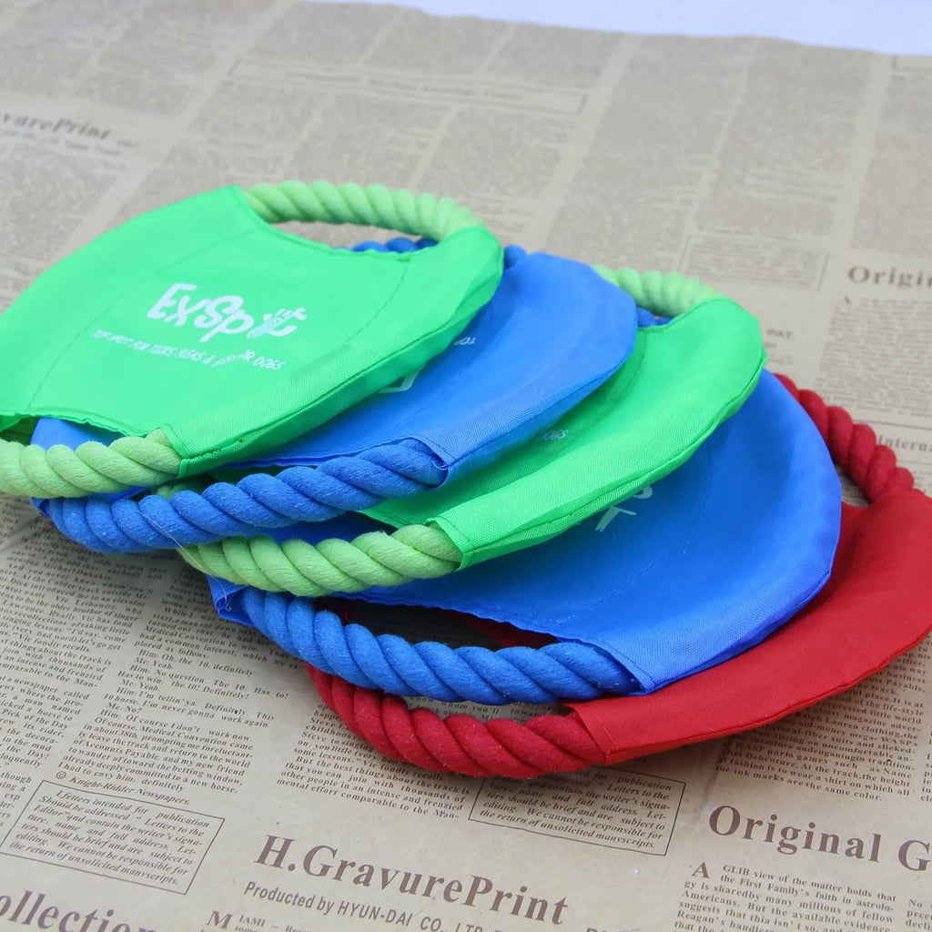 Canvas and rope dog flying disc toy 19cm diameter on grass for outdoor fetch