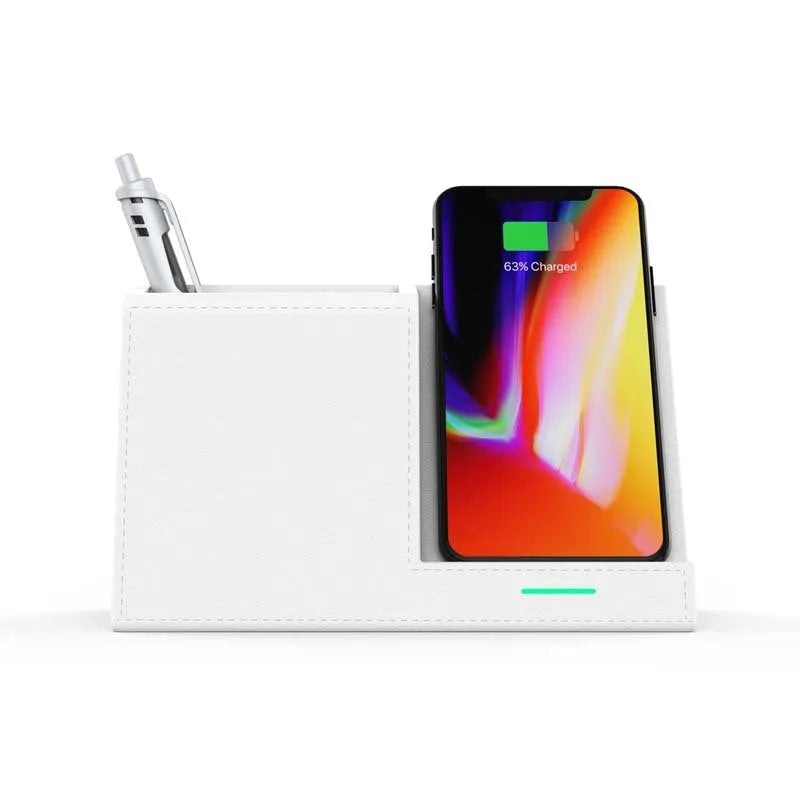 Leather pen holder wireless charger on desk with phone charging and pens organised