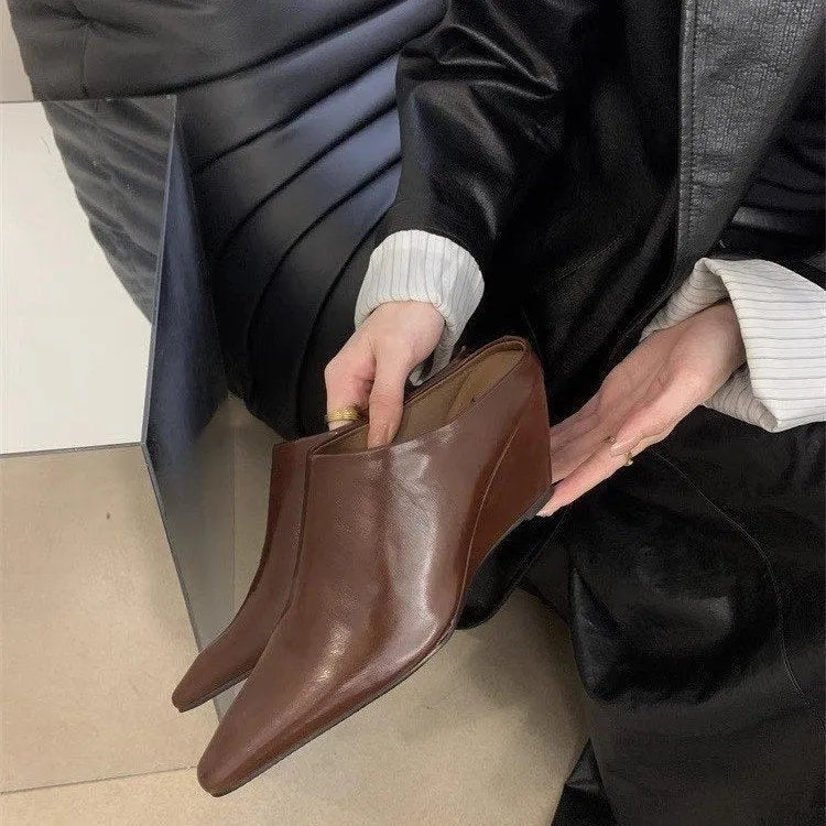 Wind wedge closed toe half slippers for women in PU upper, available in Black, Brown, and Off White