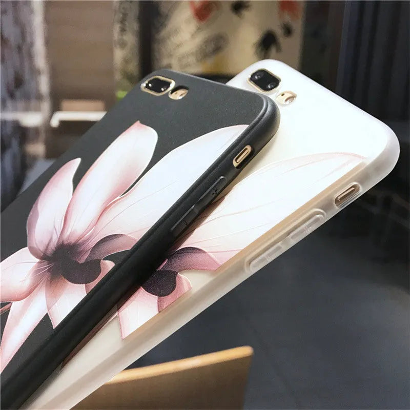 Black TPU iPhone case with embossed white flower design on back