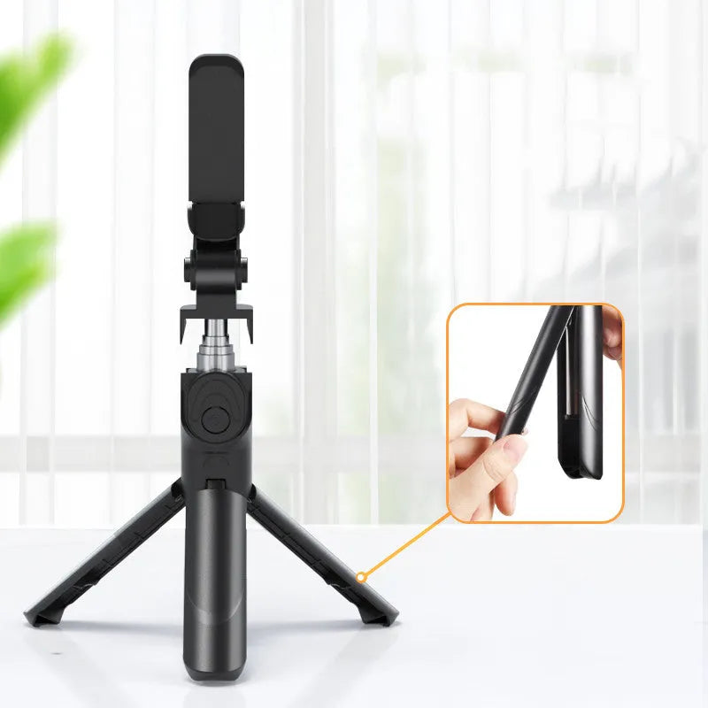 Selfie stick with aluminium alloy body and phone holder in tripod mode on a desk