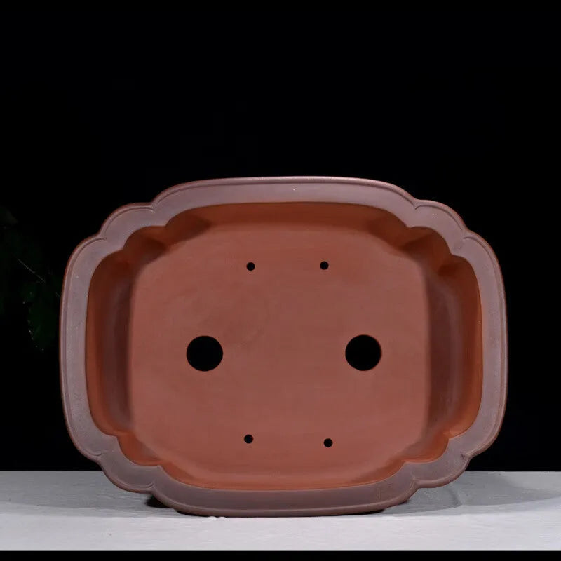 Large antique Chinese style purple clay flower pot with tree stump design and decorative botanical relief