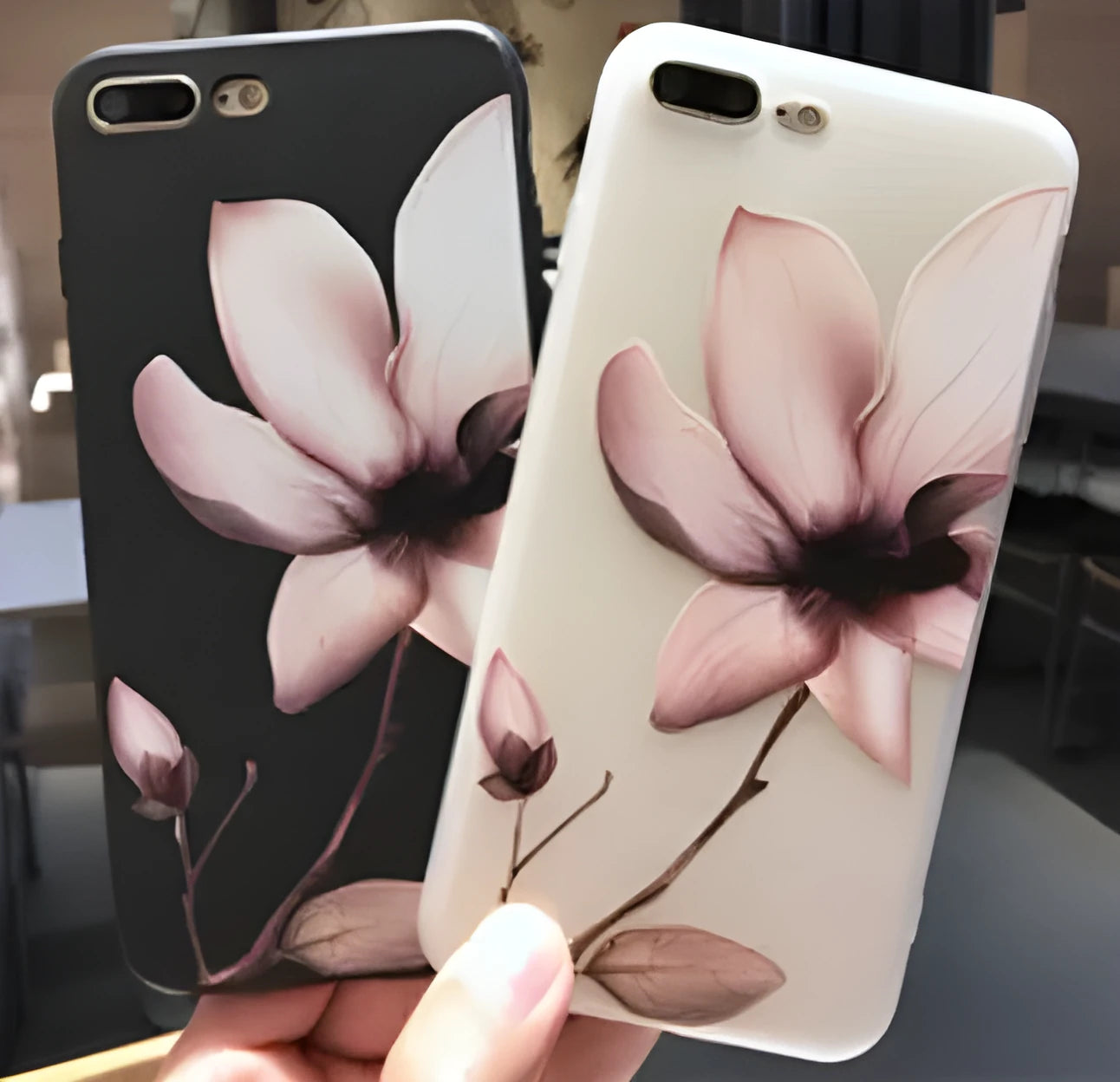 Black TPU iPhone case with embossed white flower design on back