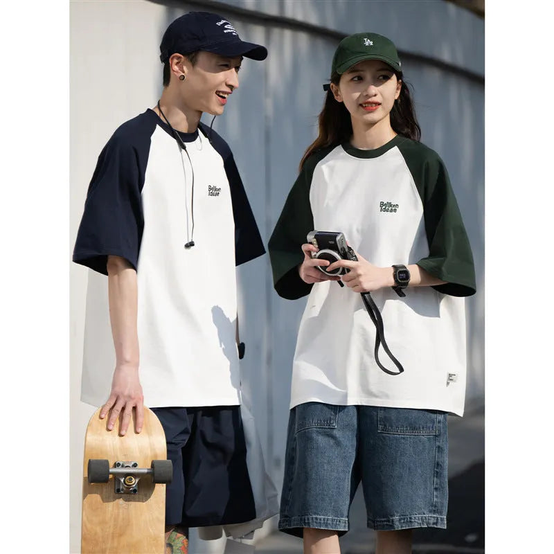 Blue loose-fit men's casual raglan sleeve T-shirt on a hanger.