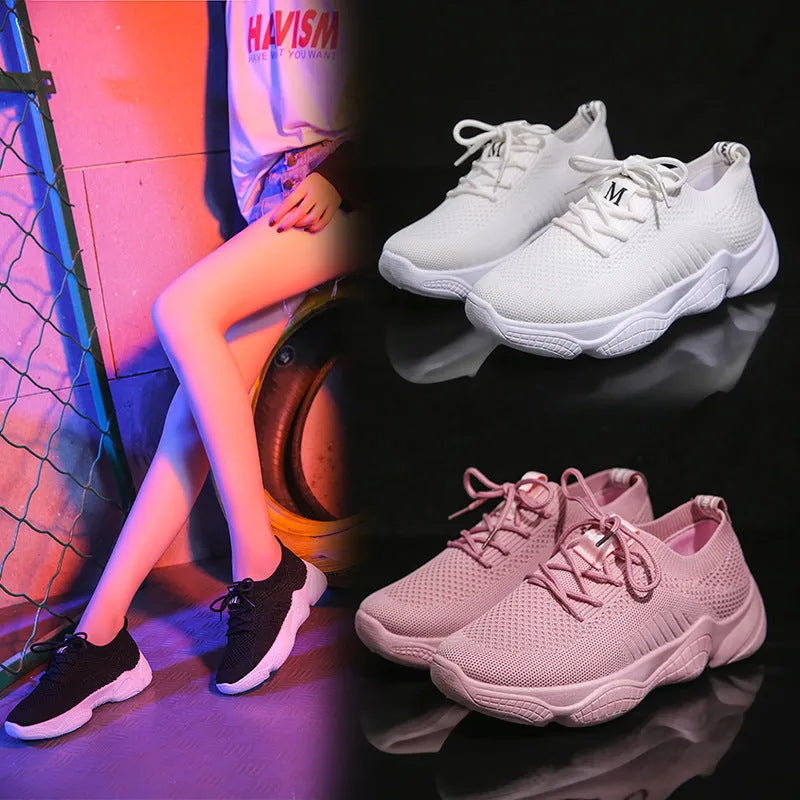 Women's white thick-soled casual sports shoes with flying woven upper and front strap.