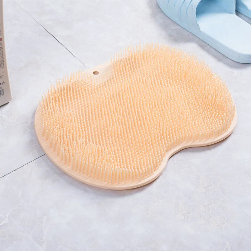Non-slip bath mat with silicone bristles and suction cup base in a shower