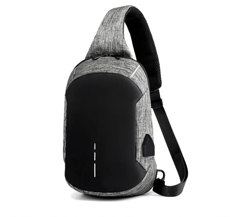Small dark blue waterproof oxford cloth chest bag showing front zipper closure and strap