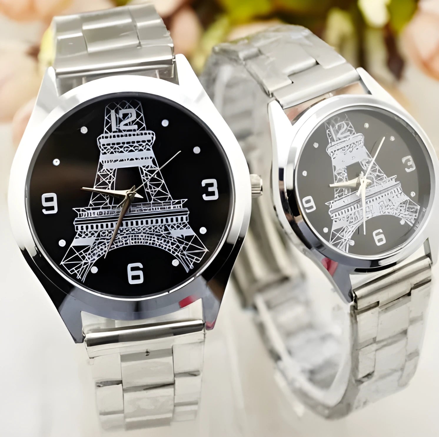 Silver Eiffel Tower wrist watch with Roman numeral dial on stainless steel strap