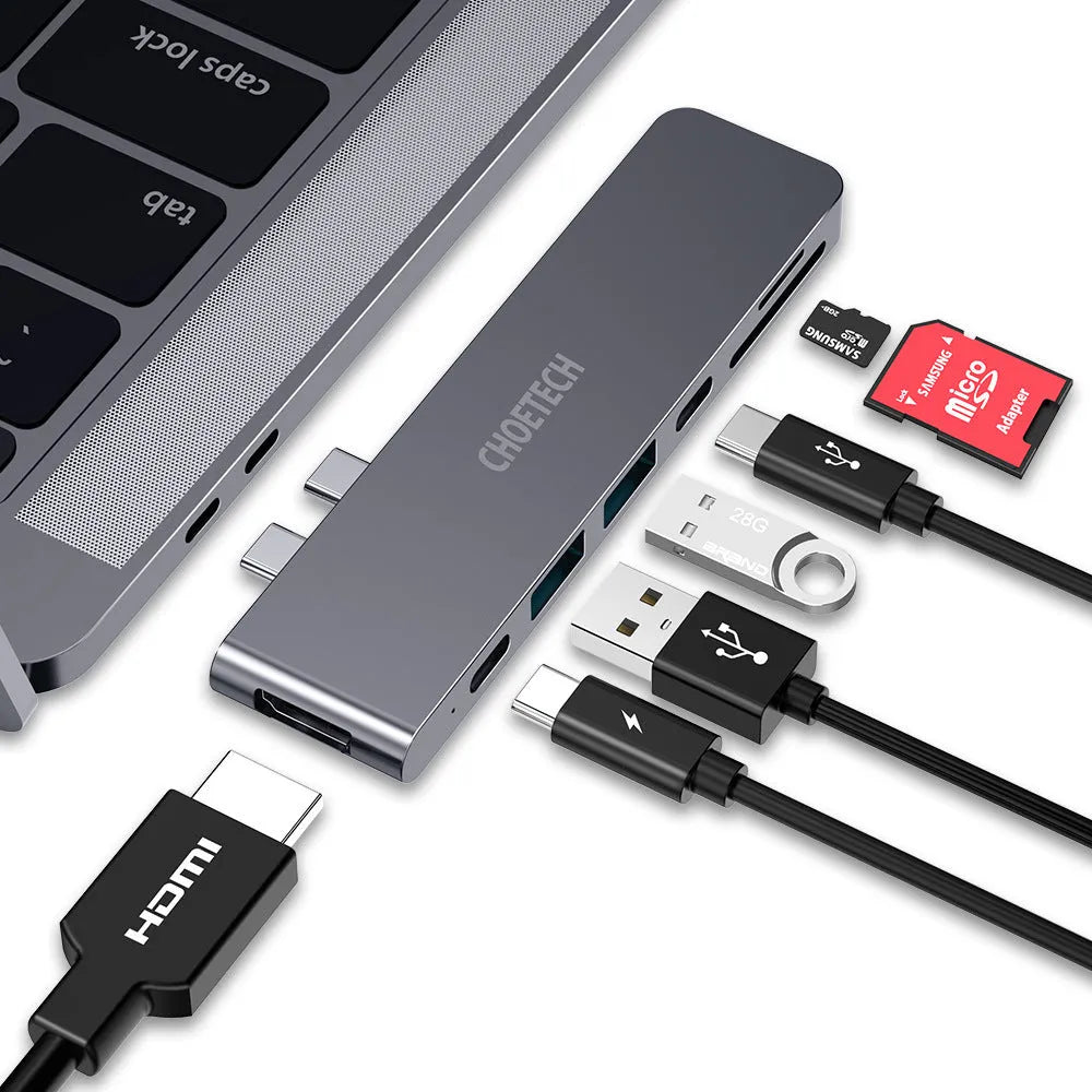 Silver aluminum Type C adapter with SD slot, HDMI port, and USB ports on a white background