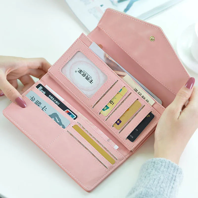 Three-fold student wallet with buckle closure in five colour options showing 19.5cm length