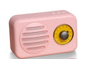 T1 portable Bluetooth speaker with wood grain finish showing compact design and speaker grille