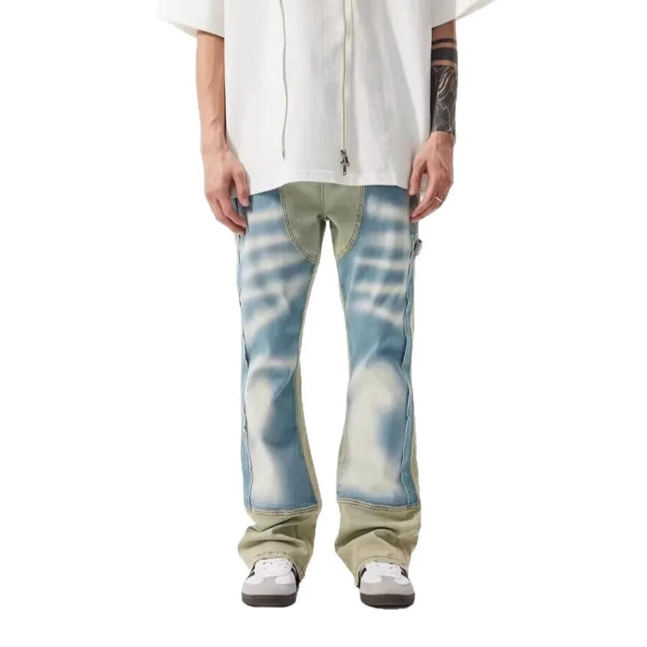 Retro dual-colour yellow and blue patchwork jeans with splash-ink damaged design, mid-waist cut