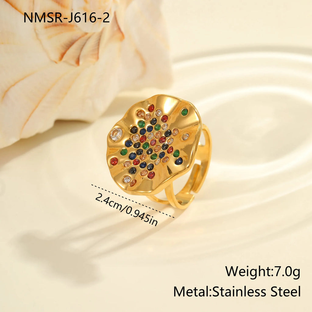 Open mouth geometric stainless steel ring with pleated detailing and colour diamond titanium accents