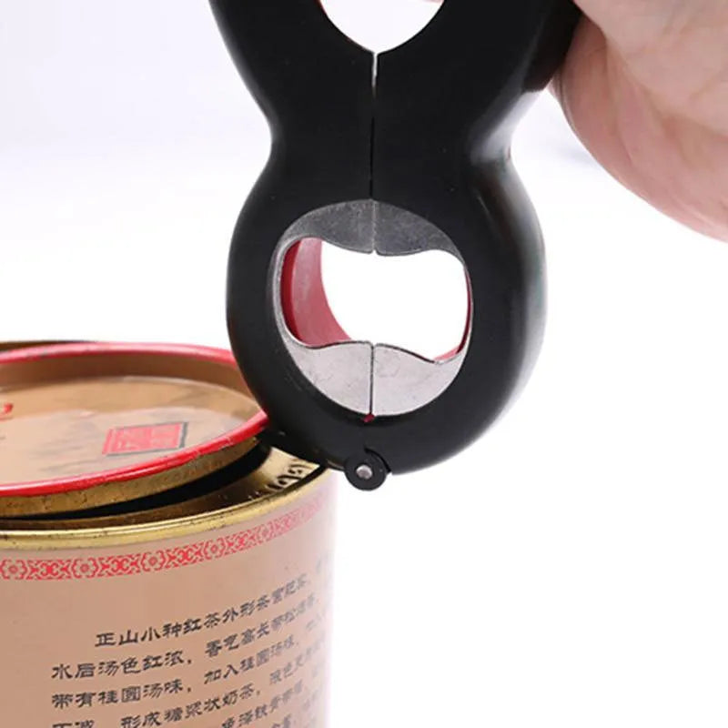 Six-in-one ergonomic bottle and can opener with stainless steel head and soft grey handle on a kitchen countertop