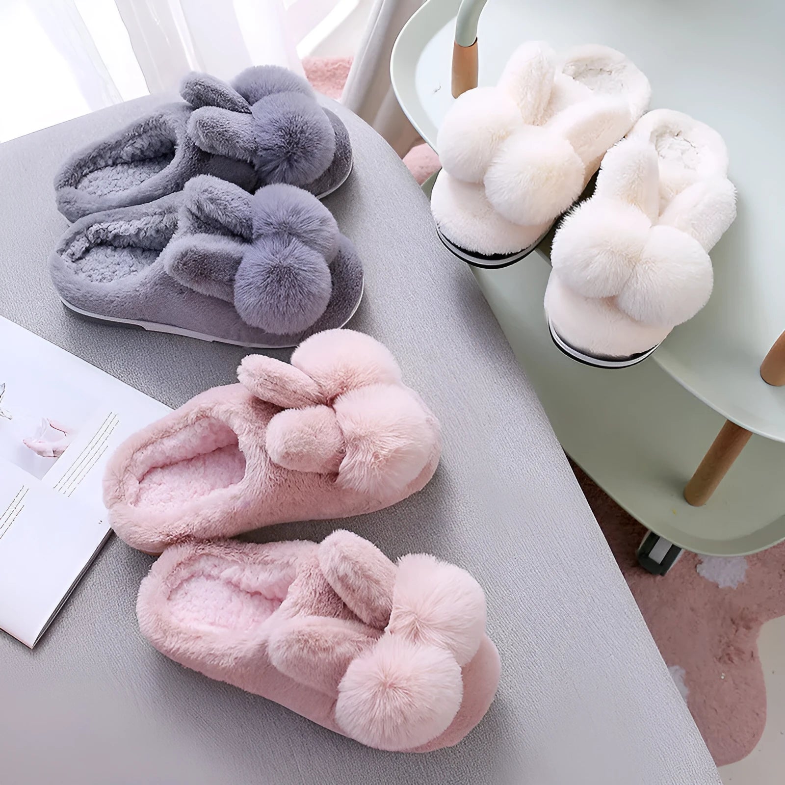 Women's fluffy rabbit fur high upper winter slippers in grey on a wooden floor.