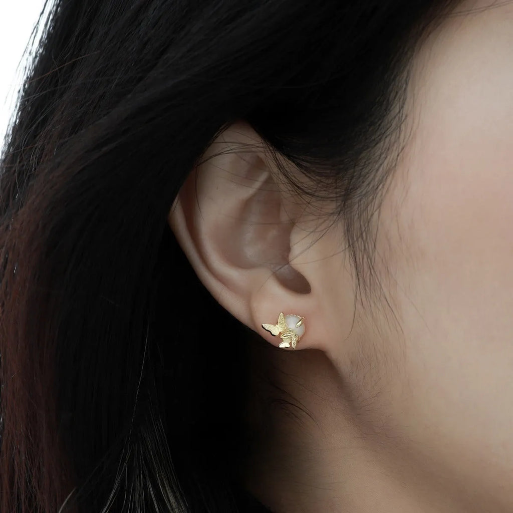 Butterfly ear studs in gold or white gold finish on 925 silver with animal zodiac design
