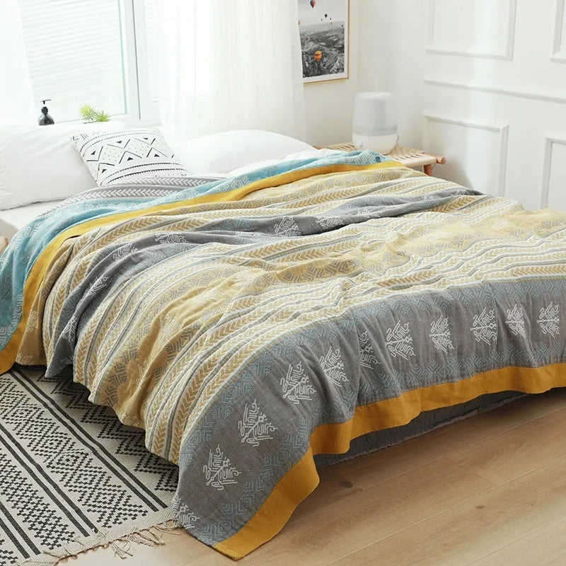 Pure cotton five-layer gauze bed sheet blanket in Roulette Wheel Blue pattern, shown on a bed.