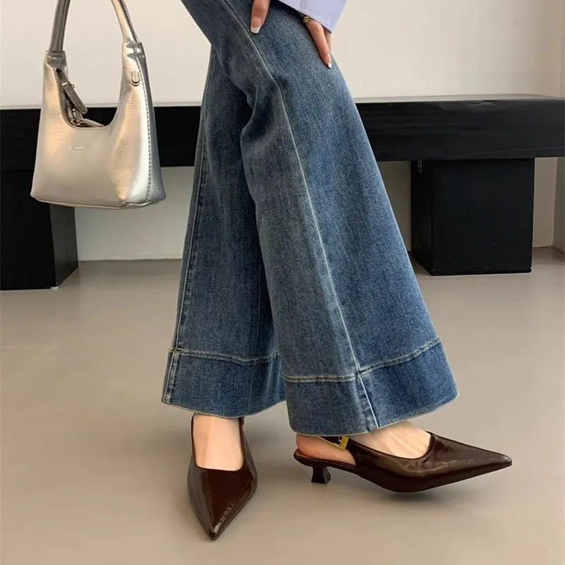 Thin low heel strap pointed leather shoes for women, black colour, side view showing heel height and ankle strap