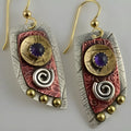 Gold tone geometric earrings with camouflage leopard print pattern on irregular stud shapes