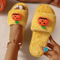 White and yellow Halloween pumpkin cartoon plush slippers with open toe and PVC sole.